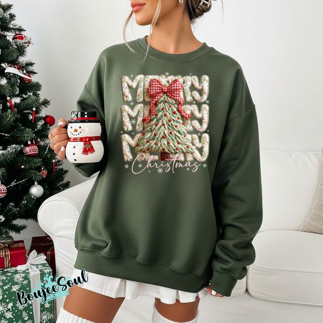 Woman wearing faux-crochet Merry Christmas sweatshirt with textured tree and gingham bow. 