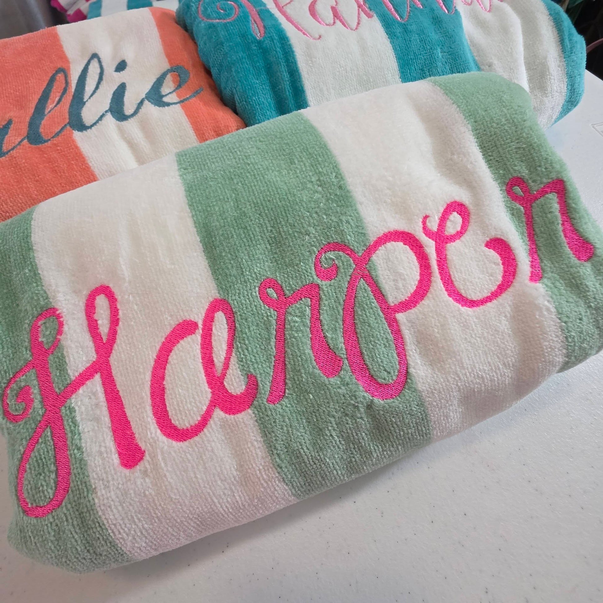 Close up of personalized cabana towel with embroidered name showing stitching detail