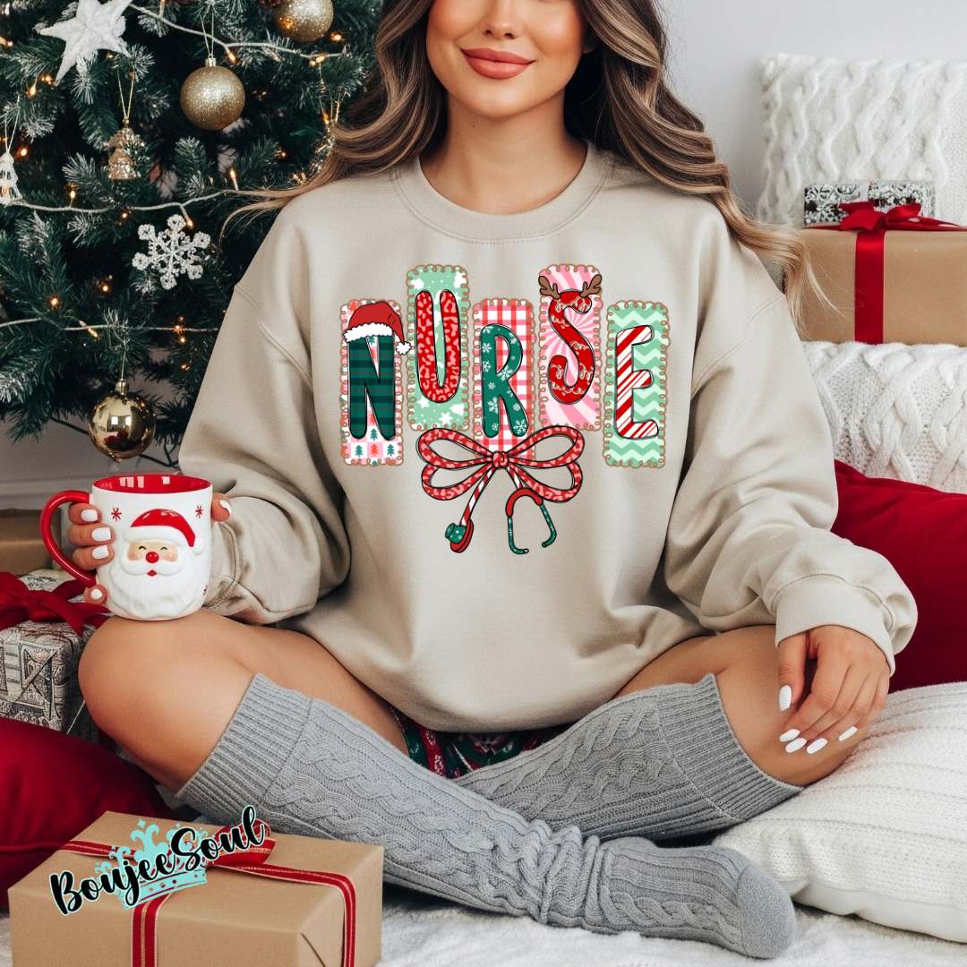 Nurse Christmas sweatshirt with patchwork holiday letters and festive stethoscope bow.