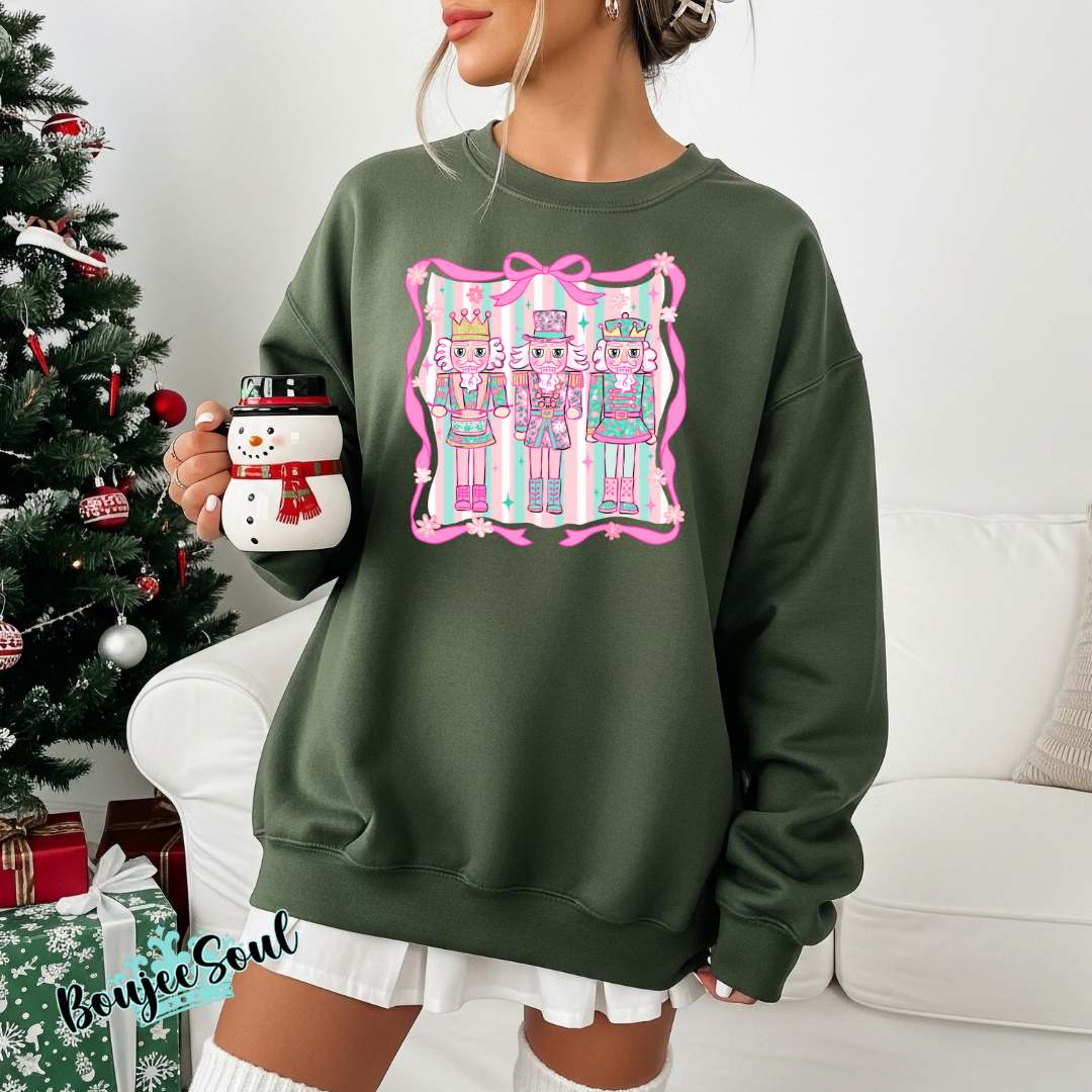 Pink and Green Nutcracker Christmas sweatshirt with pastel holiday design